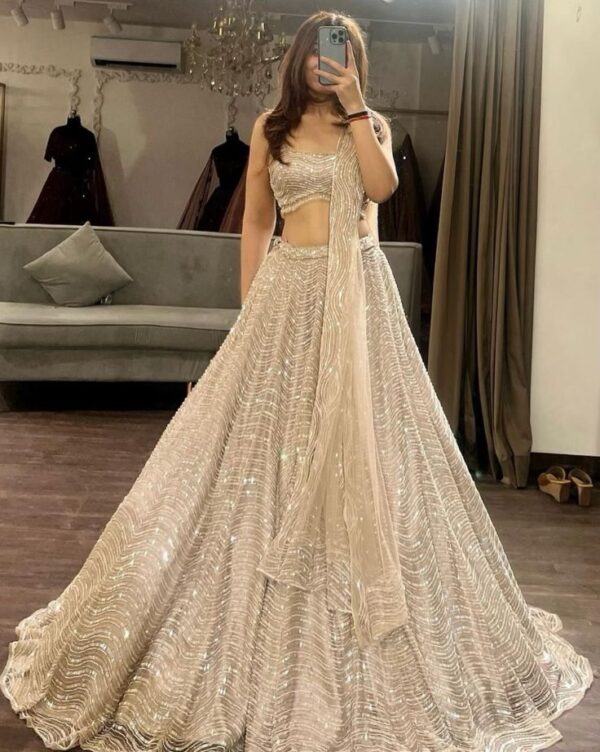 Designer Gold Color Soft Net Fabric With Sequence Work Lehenga Choli
