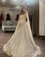 Designer Gold Color Soft Net Fabric With Sequence Work Lehenga Choli