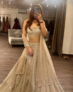 Designer Gold Color Soft Net Fabric With Sequence Work Lehenga Choli