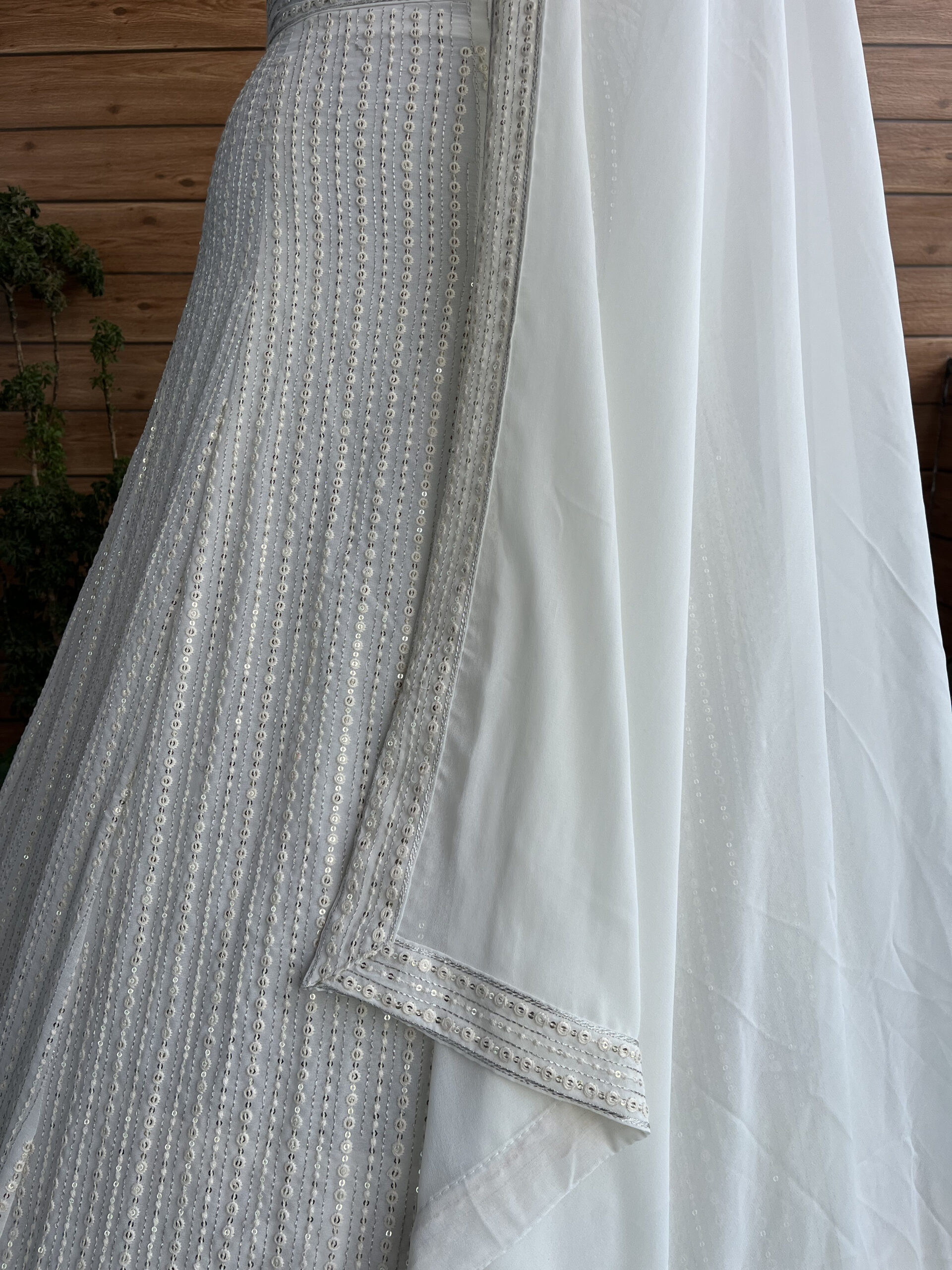 White Color Faux Georgette Fabric Sequence Thread Work Lehenga Choli