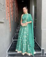 Teal Green Color Pure Banarasi Jacquard Dola Silk Fabric Border Work Gown