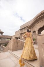 Gold Color Soft Net Fabric Coding With Sequence Work Lehenga