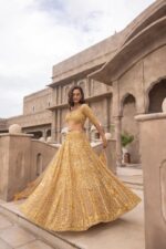 Gold Color Soft Net Fabric Coding With Sequence Work Lehenga